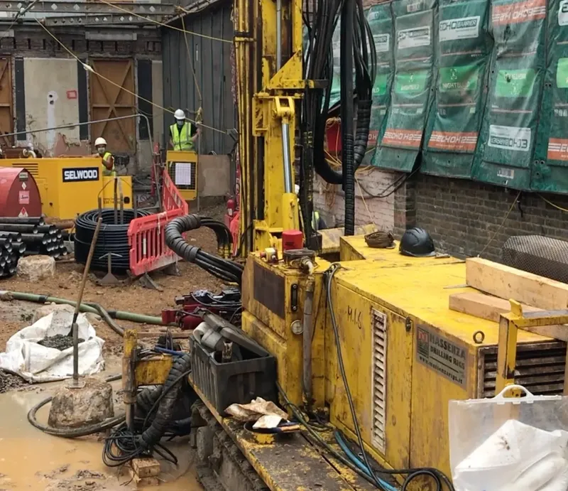 A drilling rig finalising the last of several bore holes for ground source heat pumps on a project in London.